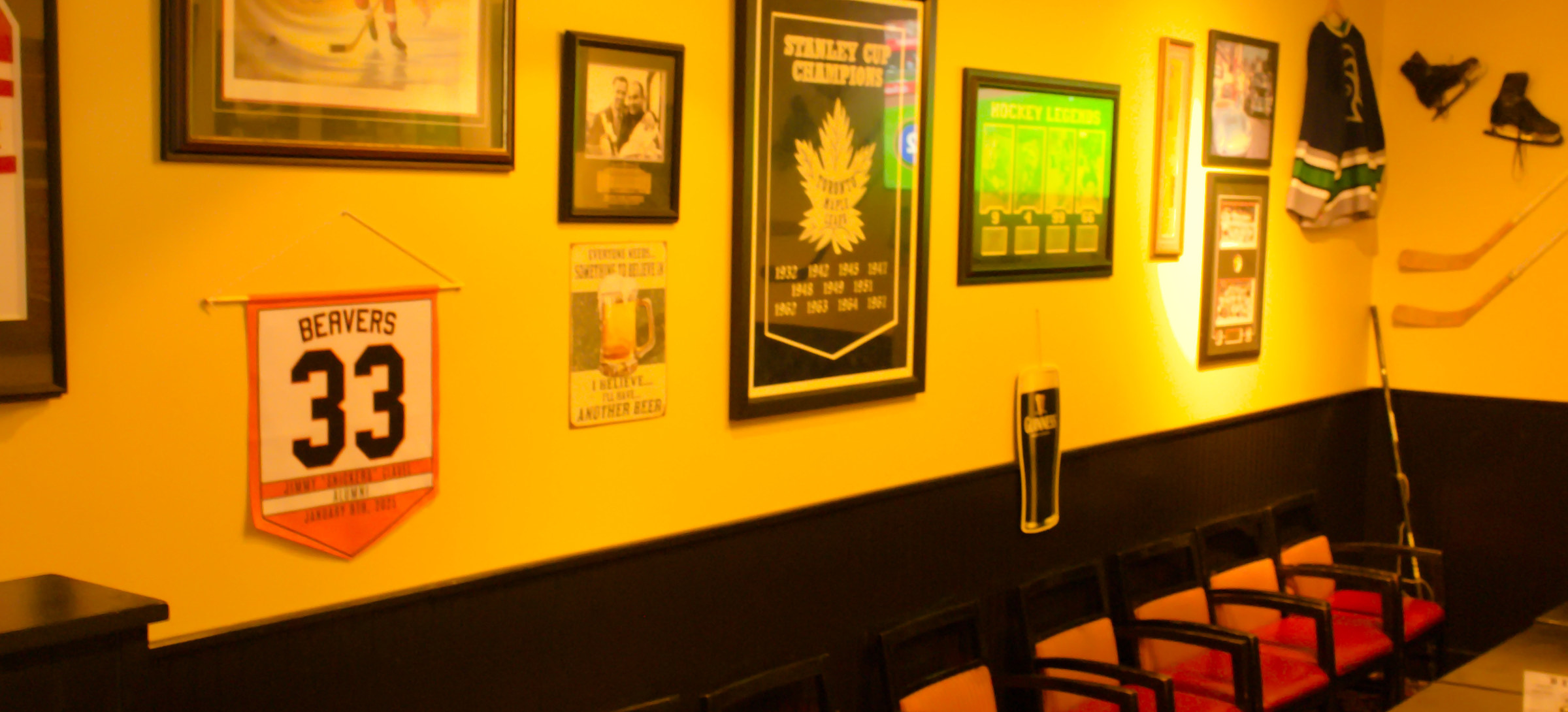 The private party room at Puckz Pub, chairs set along a long table